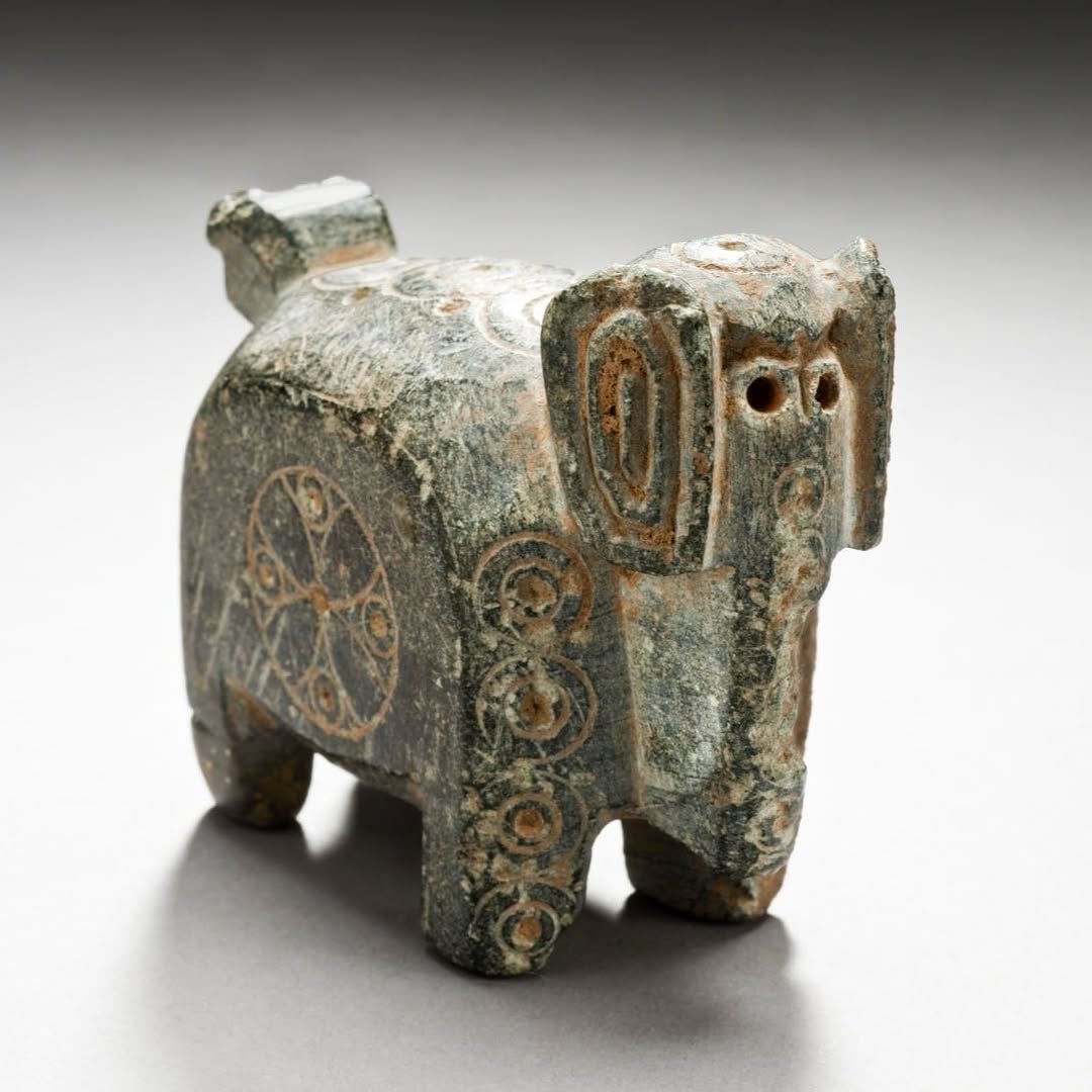 A modest yet beautifully carved stone elephant from Nishapur, northeastern Iran, 10th century CE. A Persian artisan likely originally created it as one of the pieces for a chess se