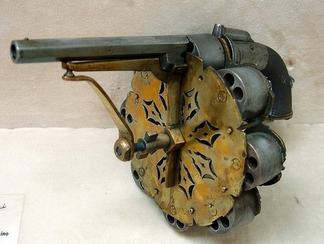 The Enui Revolver - This strange revolver is a unique prototype patented by Joseph Enui of Middlesex, England, who received patent number 1359 in 1855. It has eight 48-shot cylinde